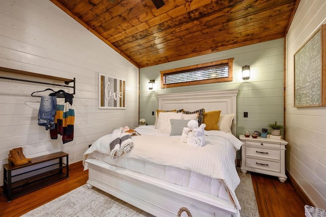 bedroom featuring hardwood / wood-style flooring, vaulted ceiling, and wood ceiling