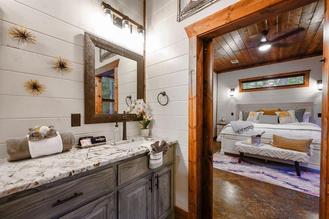 bathroom featuring tile patterned flooring, vanity, wooden walls, and wood ceiling