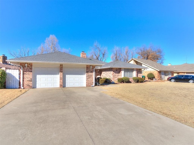 single story home featuring a front yard and a garage