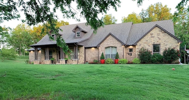 french country inspired facade with a front yard