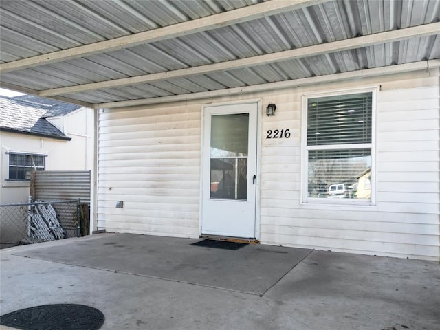 property entrance featuring a patio