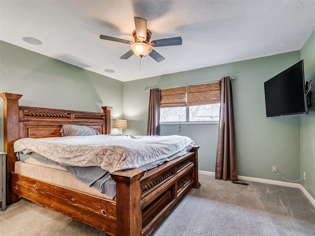 bedroom with ceiling fan and light colored carpet