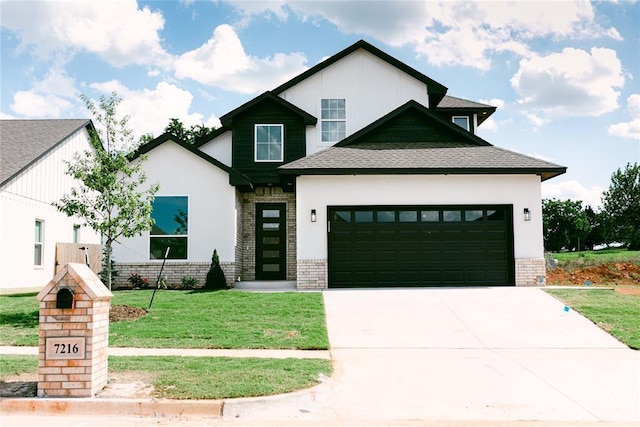 view of front of home featuring a garage and a front lawn