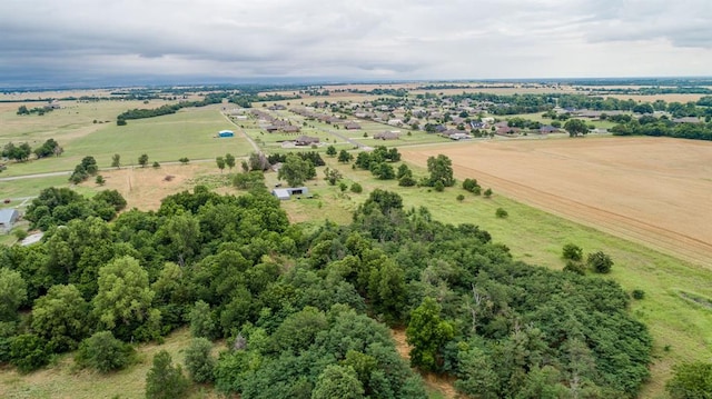 birds eye view of property with a rural view