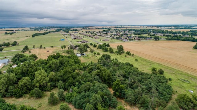 birds eye view of property with a rural view