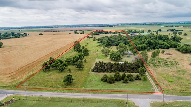 birds eye view of property featuring a rural view