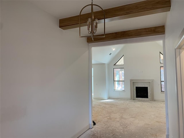 unfurnished living room with a chandelier and vaulted ceiling with beams