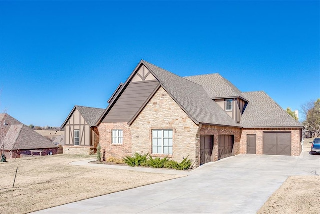 tudor house featuring a garage