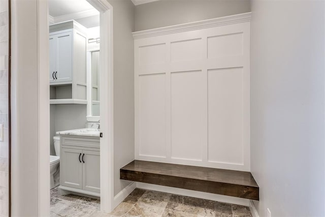 mudroom featuring ornamental molding