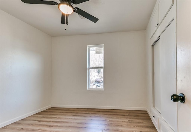 unfurnished room with ceiling fan and light hardwood / wood-style flooring