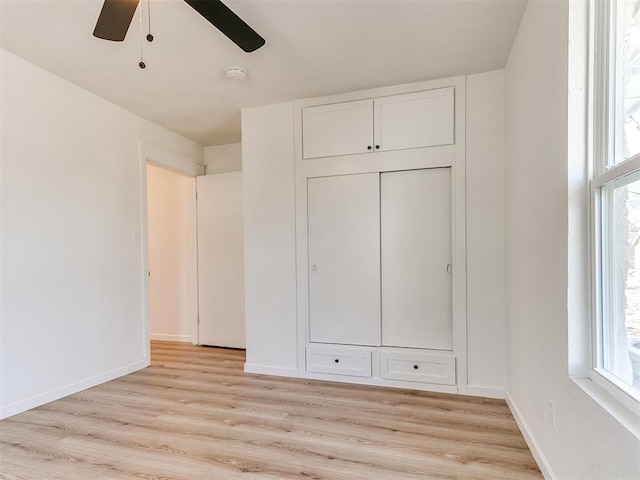 unfurnished bedroom featuring ceiling fan and light hardwood / wood-style flooring