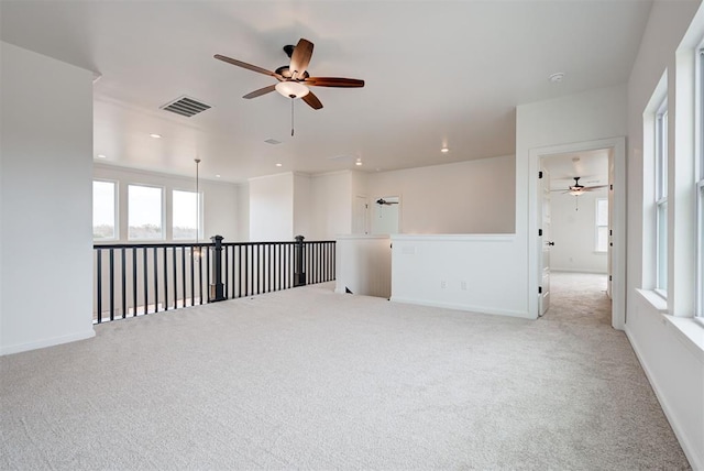 unfurnished room featuring baseboards, recessed lighting, visible vents, and light colored carpet