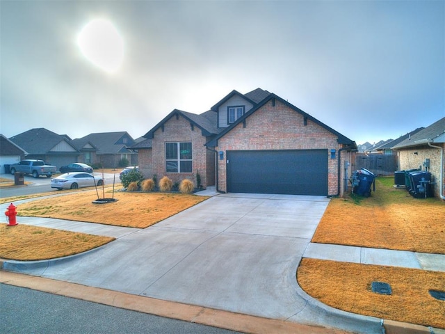 craftsman-style home featuring a garage and a front lawn