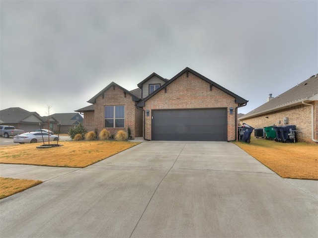 view of front facade with a garage and a front lawn