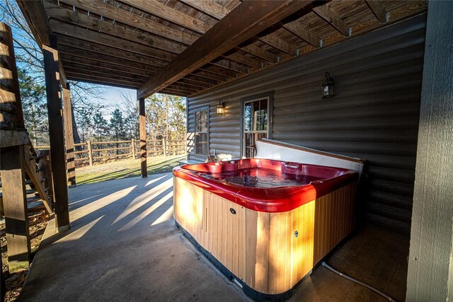 view of patio with a hot tub