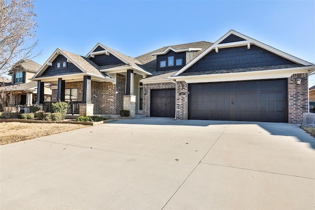 craftsman-style home with a porch and a garage