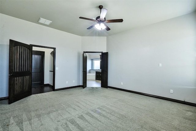 unfurnished bedroom featuring carpet and ceiling fan