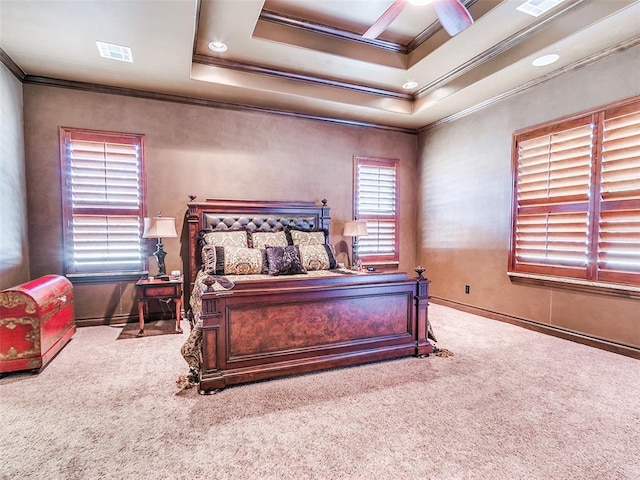 bedroom with carpet floors, a raised ceiling, ceiling fan, and ornamental molding