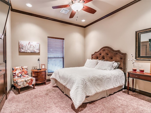 carpeted bedroom featuring ceiling fan and ornamental molding