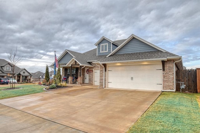 view of front of house featuring a front lawn and a garage