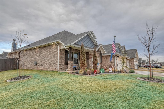 view of front of house featuring a garage and a front lawn