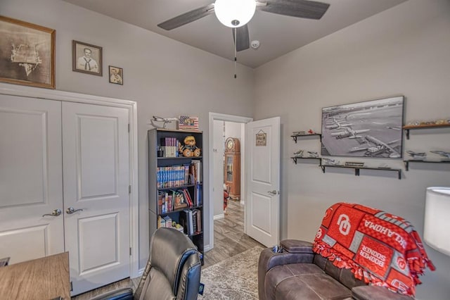 office space with ceiling fan and light hardwood / wood-style floors