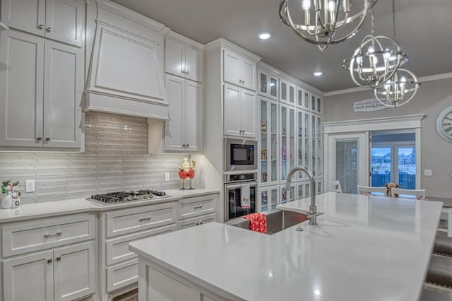 kitchen with sink, stainless steel appliances, backsplash, white cabinets, and custom exhaust hood