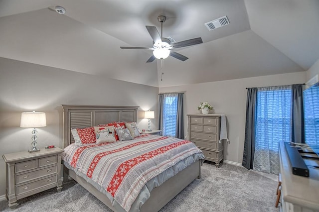 bedroom featuring ceiling fan, light carpet, and vaulted ceiling