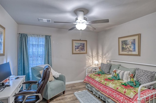 bedroom featuring hardwood / wood-style floors and ceiling fan