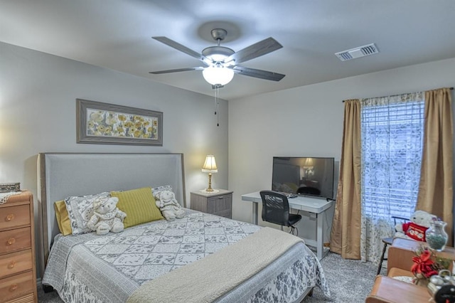 bedroom with ceiling fan and light carpet