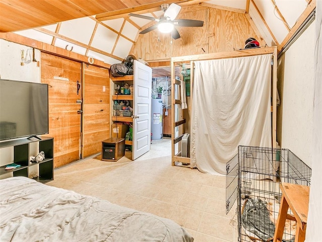 bedroom featuring vaulted ceiling, ceiling fan, wooden walls, and water heater