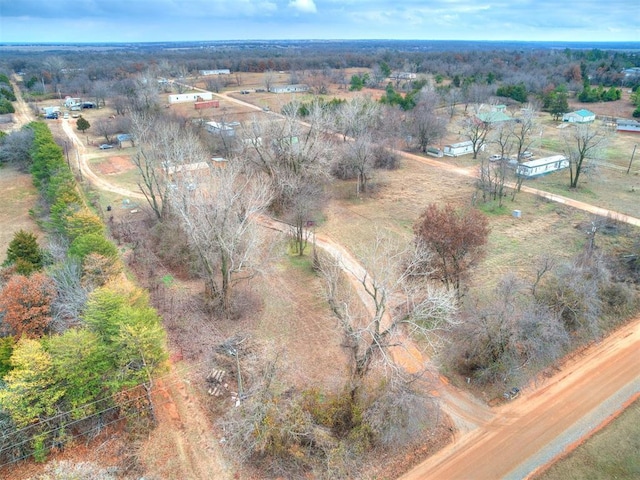 birds eye view of property featuring a rural view