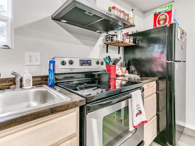 kitchen with stainless steel electric range oven, light brown cabinets, sink, range hood, and wood-type flooring