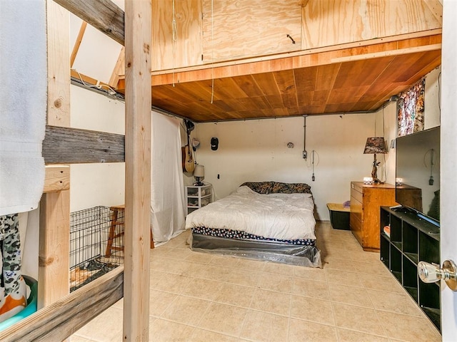 bedroom featuring tile patterned flooring and wooden ceiling