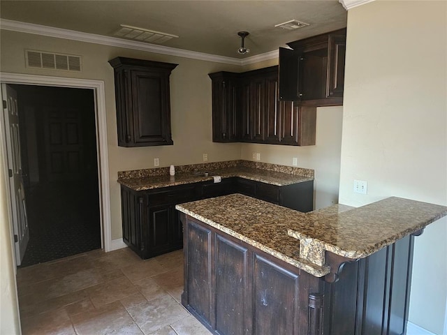 kitchen featuring kitchen peninsula, dark brown cabinetry, stone countertops, and ornamental molding