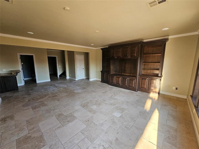 unfurnished living room featuring crown molding