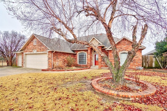 ranch-style home featuring a garage