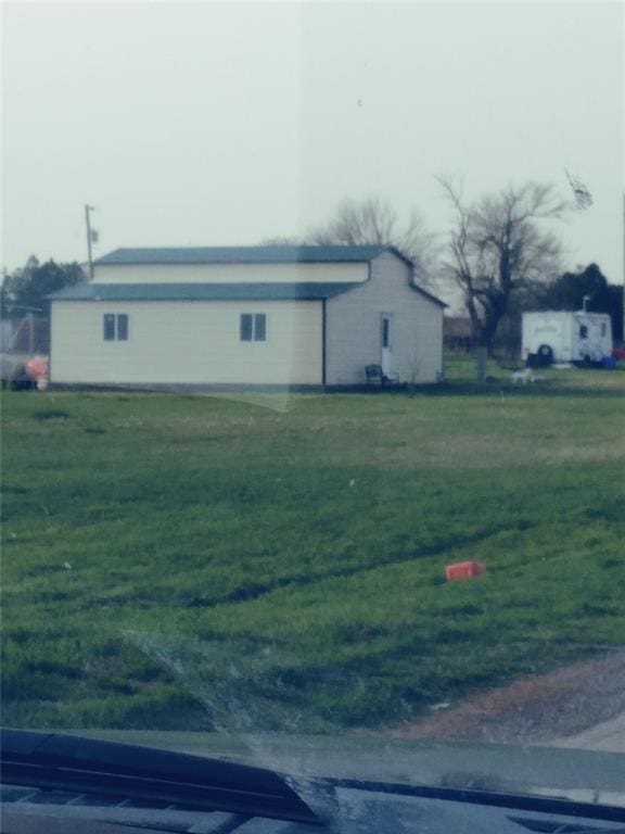 view of property exterior featuring a lawn