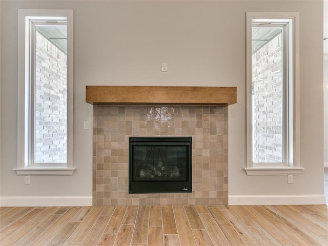 details featuring a tile fireplace