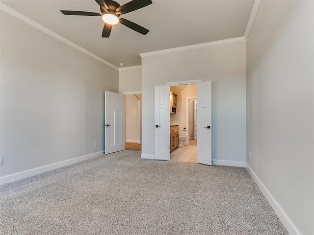 unfurnished bedroom with connected bathroom, ceiling fan, crown molding, and light carpet