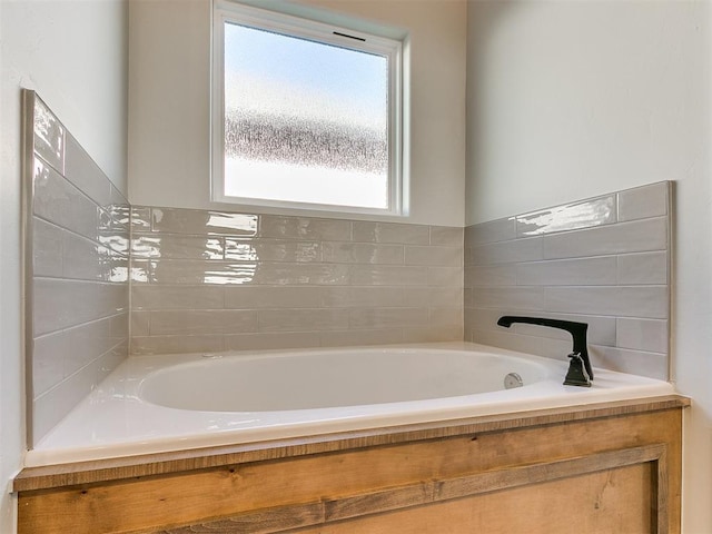 bathroom with a washtub