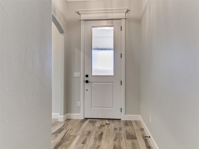 doorway to outside featuring light wood-type flooring