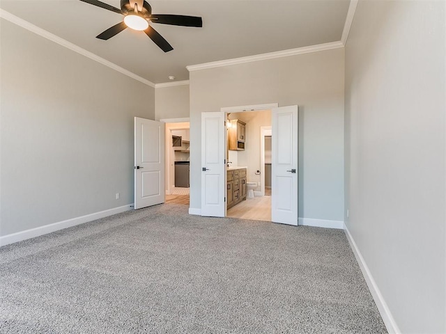 unfurnished bedroom featuring connected bathroom, light colored carpet, ceiling fan, and ornamental molding