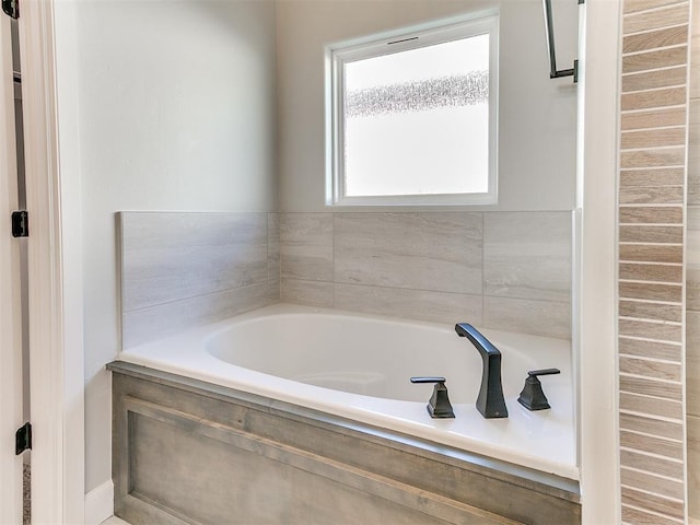 bathroom featuring a tub to relax in