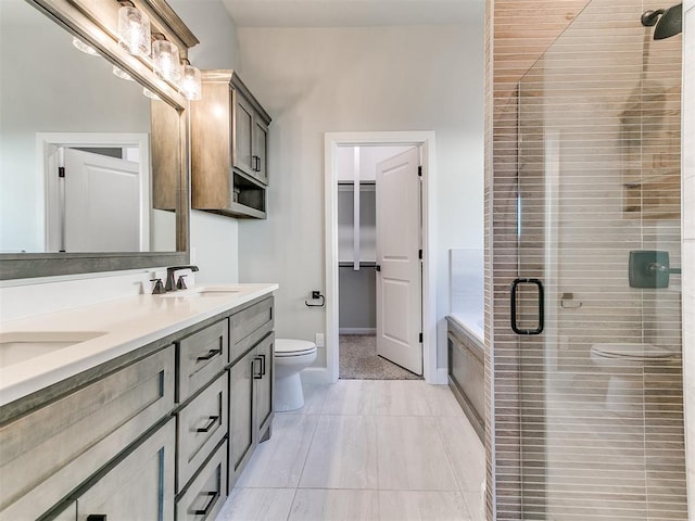 full bathroom featuring vanity, tile patterned flooring, plus walk in shower, and toilet