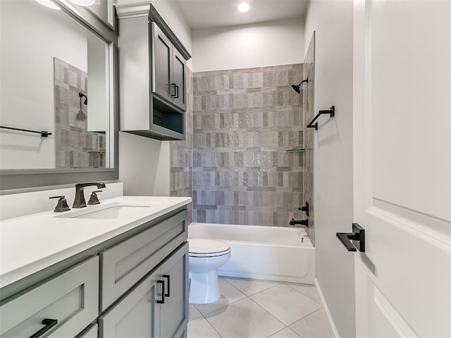 full bathroom featuring toilet, vanity, tile patterned floors, and tiled shower / bath