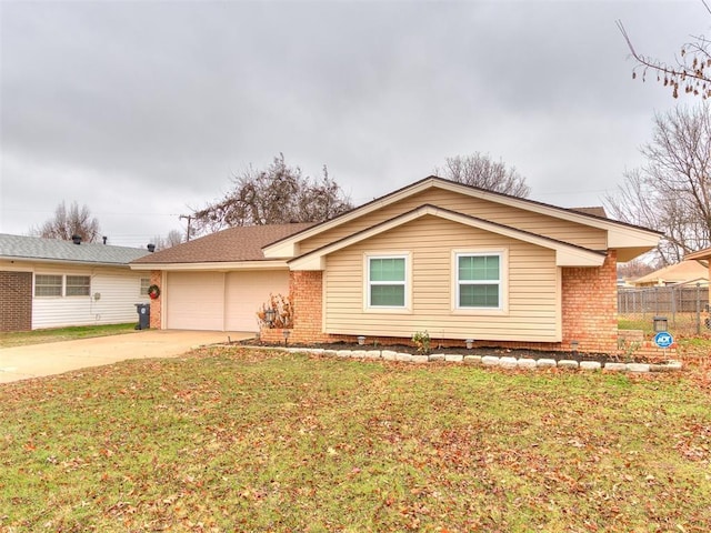 ranch-style home with a garage and a front lawn