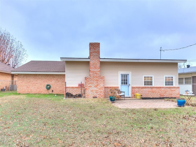 back of property featuring a patio area, a yard, and cooling unit