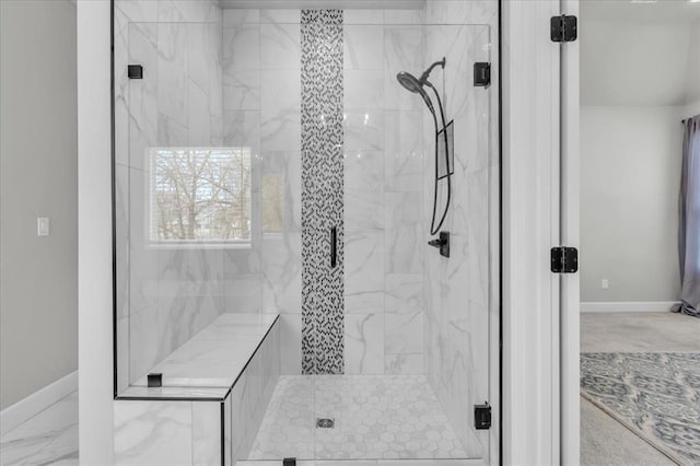 bathroom with a shower with shower door