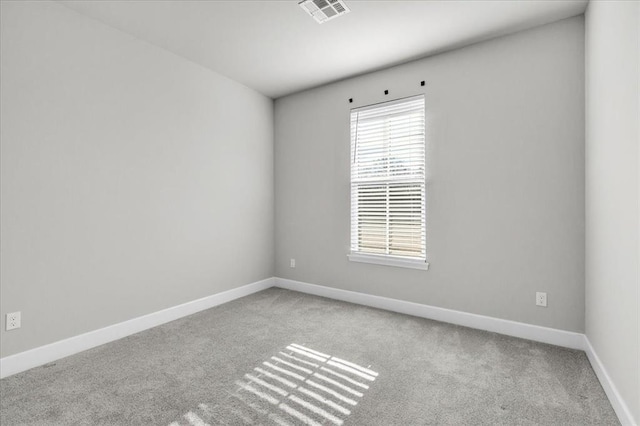 spare room with light carpet